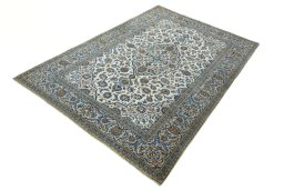 Corner detail of 2000s Kashan rug showing border pattern and Wool pile