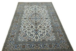 Surface texture of 2000s Kashan rug with natural Wool and intricate pattern