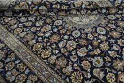 Close-up detail of 2000s Kashan rug from Iran / Persia showing Wool weave