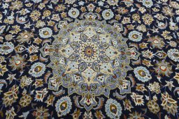 Central medallion detail of 2000s Kashan rug from Iran / Persia