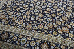 Close-up detail of 2000s Kashan rug from Iran / Persia showing Wool weave