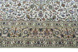 Corner detail of 2000s Kashan rug showing border pattern and Wool pile