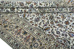 Close-up detail of 2000s Kashan rug from Iran / Persia showing Wool weave
