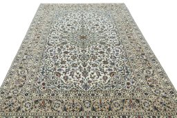 Surface texture of 2000s Kashan rug with natural Wool and intricate pattern