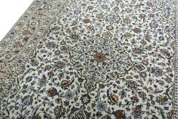 Backside of handmade 2000s Kashan rug showing knot structure and weave density