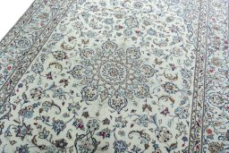 Backside of handmade 2000s Kashan rug showing knot structure and weave density