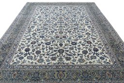 Surface texture of 2000s Kashan rug with natural Wool and intricate pattern