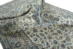 Surface texture of 2000s Kashan rug with natural Wool and intricate pattern