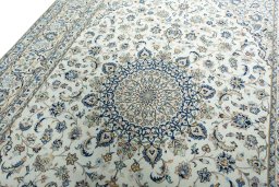 Backside of handmade 2000s Kashan rug showing knot structure and weave density