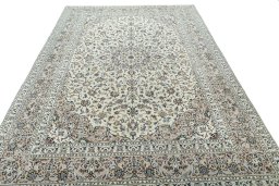 Surface texture of 2000s Kashan rug with natural Wool and intricate pattern
