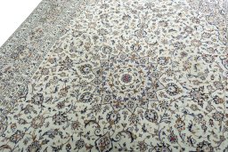 Backside of handmade 2000s Kashan rug showing knot structure and weave density