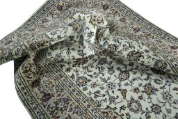 Surface texture of 2000s Kashan rug with natural Wool and intricate pattern