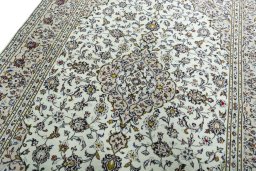 Backside of handmade 2000s Kashan rug showing knot structure and weave density