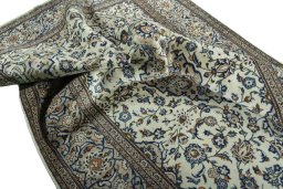 Surface texture of 2000s Kashan rug with natural Wool and intricate pattern