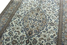Backside of handmade 2000s Kashan rug showing knot structure and weave density