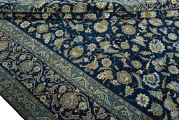 Close-up detail of 2000s Kashan rug from Iran / Persia showing Wool weave
