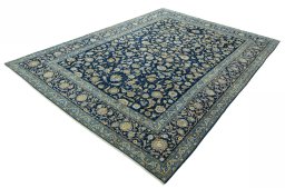 Corner detail of 2000s Kashan rug showing border pattern and Wool pile