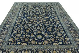Surface texture of 2000s Kashan rug with natural Wool and intricate pattern