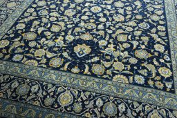 Close-up detail of 2000s Kashan rug from Iran / Persia showing Wool weave