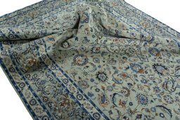 Surface texture of 2000s Kashan rug with natural Wool and intricate pattern