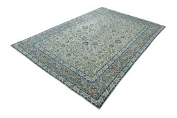 Corner detail of 2000s Kashan rug showing border pattern and Wool pile