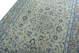 Backside of handmade 2000s Kashan rug showing knot structure and weave density