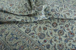 Surface texture of 2000s Kashan rug with natural Wool and intricate pattern