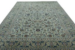 Surface texture of 2000s Kashan rug with natural Wool and intricate pattern