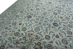 Backside of handmade 2000s Kashan rug showing knot structure and weave density