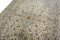 Backside of handmade 2000s Kashan rug showing knot structure and weave density