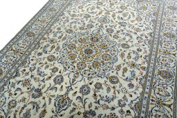 Backside of handmade New Kashan rug showing knot structure and weave density