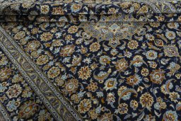 Close-up detail of 2000s Kashan rug from Iran / Persia showing Wool weave