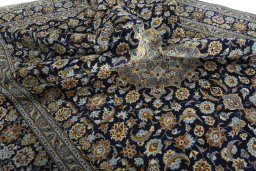 Surface texture of 2000s Kashan rug with natural Wool and intricate pattern