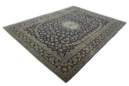 Corner detail of 2000s Kashan rug showing border pattern and Wool pile