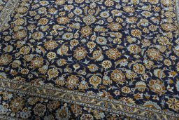 Close-up detail of 2000s Kashan rug from Iran / Persia showing Wool weave