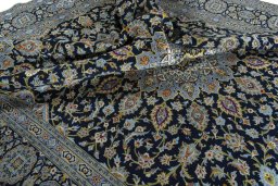 Surface texture of 2000s Kashan rug with natural Wool and intricate pattern