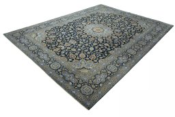 Corner detail of 2000s Kashan rug showing border pattern and Wool pile