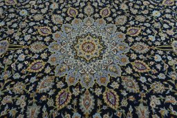 Central medallion detail of 2000s Kashan rug from Iran / Persia