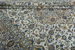 Close-up detail of 2000s Kashan rug from Iran / Persia showing Wool weave