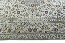 Corner detail of 2000s Kashan rug showing border pattern and Wool pile