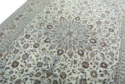 Backside of handmade 2000s Kashan rug showing knot structure and weave density
