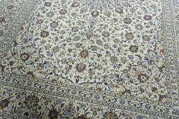 Close-up detail of 2000s Kashan rug from Iran / Persia showing Wool weave