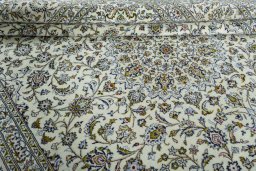 Close-up detail of 2000s Kashan rug from Iran / Persia showing Wool weave