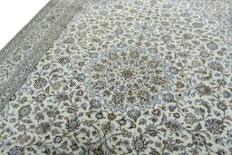 Backside of handmade 2000s Kashan rug showing knot structure and weave density