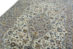 Backside of handmade 2000s Kashan rug showing knot structure and weave density