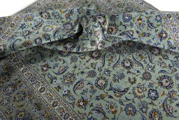 Surface texture of 2000s Kashan rug with natural Wool and intricate pattern