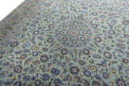 Backside of handmade 2000s Kashan rug showing knot structure and weave density