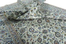 Surface texture of 2000s Kashan rug with natural Wool and intricate pattern