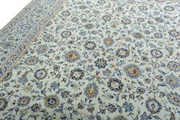 Backside of handmade 2000s Kashan rug showing knot structure and weave density