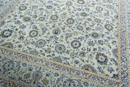 Close-up detail of 2000s Kashan rug from Iran / Persia showing Wool weave
